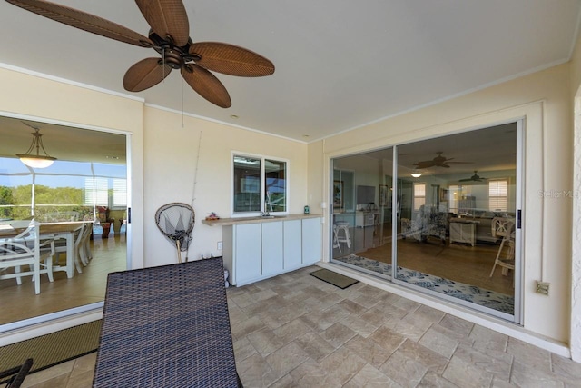 exterior space featuring ceiling fan