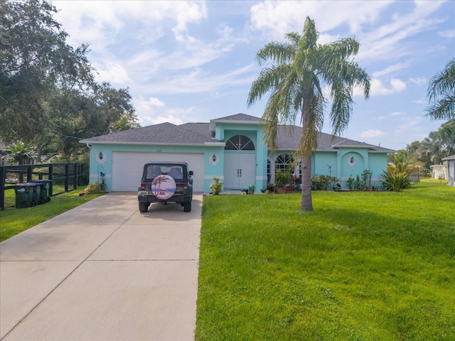 ranch-style house with a front yard and a garage