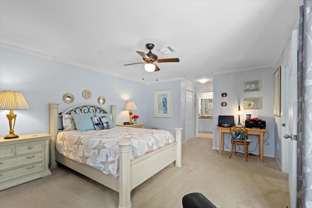 bedroom with crown molding, ceiling fan, a closet, ensuite bathroom, and light colored carpet