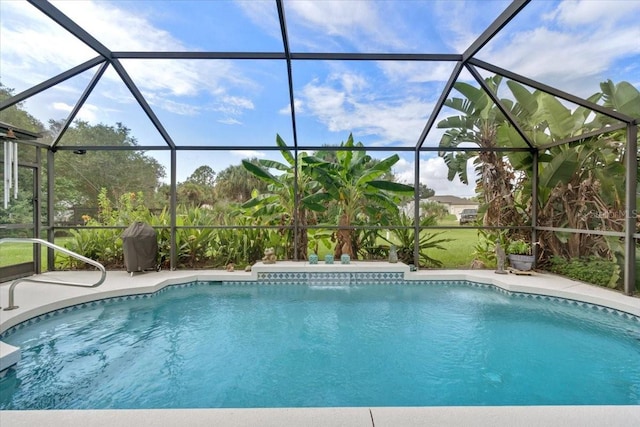 view of pool featuring grilling area and glass enclosure