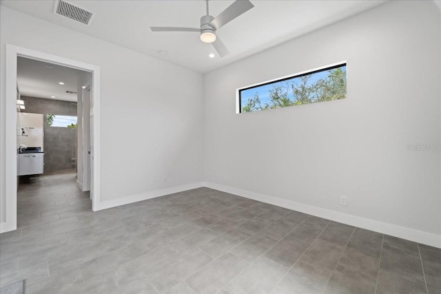 unfurnished room with ceiling fan