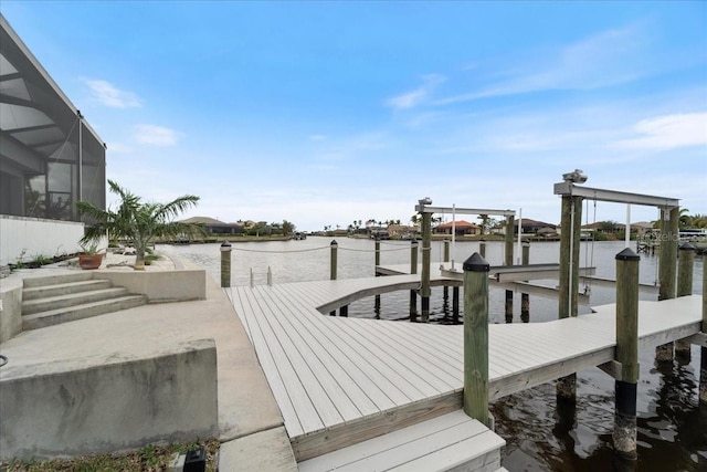 view of dock with a water view and glass enclosure