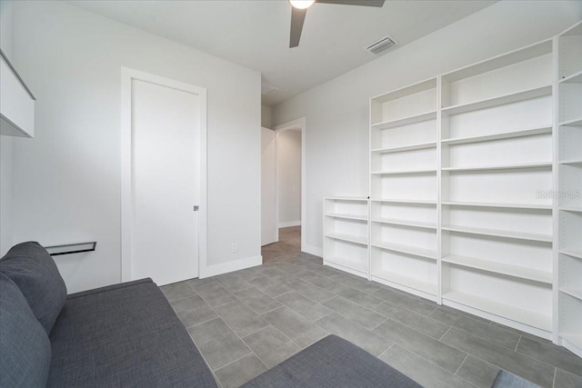 unfurnished living room with ceiling fan