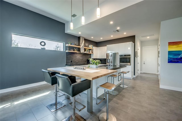 3715 NW 9th Ter, Cape Coral, FL 33993 - kitchen featuring stainless steel appliances, butcher block counters, backsplash, open shelves, and white cabinets