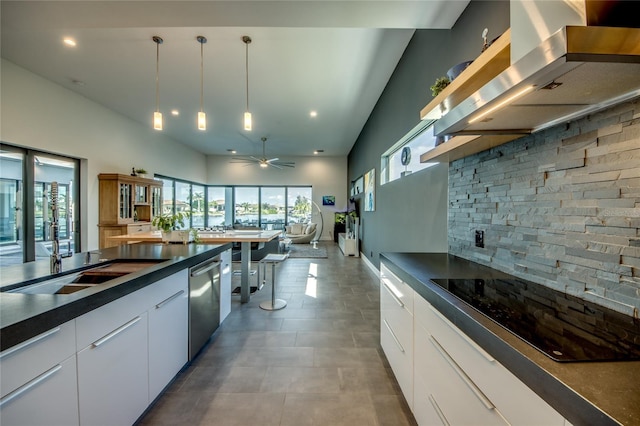 3715 NW 9th Ter, Cape Coral, FL 33993 - kitchen with wall chimney range hood, dark countertops, stainless steel dishwasher, open shelves, and hanging light fixtures