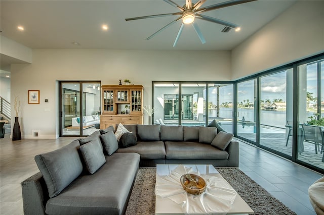 3715 NW 9th Ter, Cape Coral, FL 33993 - living area featuring a ceiling fan, recessed lighting, and a water view