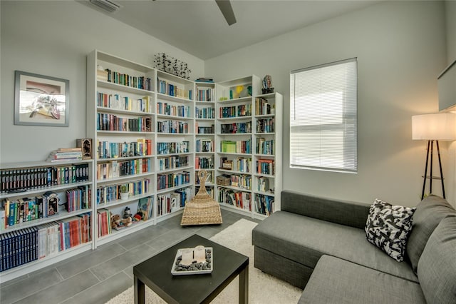 3715 NW 9th Ter, Cape Coral, FL 33993 - living area with ceiling fan and bookshelves