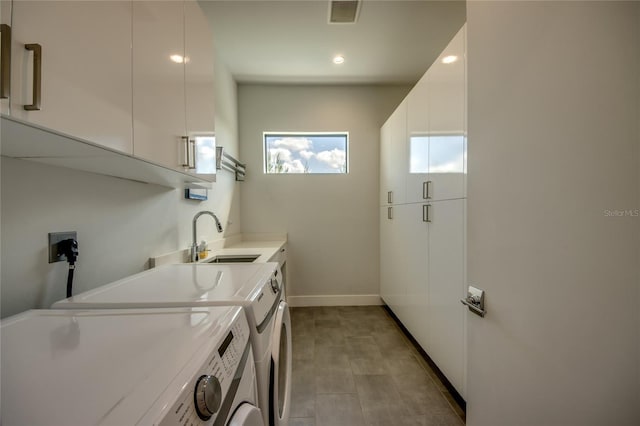 3715 NW 9th Ter, Cape Coral, FL 33993 - laundry area featuring cabinet space, separate washer and dryer, baseboards, and recessed lighting