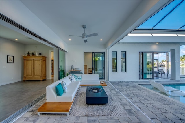 3715 NW 9th Ter, Cape Coral, FL 33993 - view of patio / terrace featuring a ceiling fan, an outdoor living space with a fire pit, and an outdoor pool