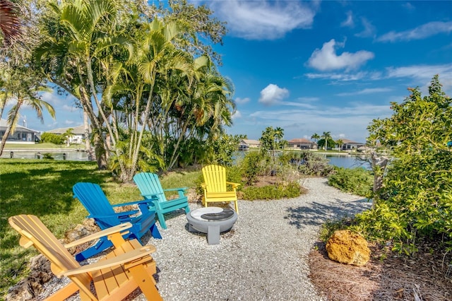 3715 NW 9th Ter, Cape Coral, FL 33993 - view of community with a fire pit, a yard, and a water view