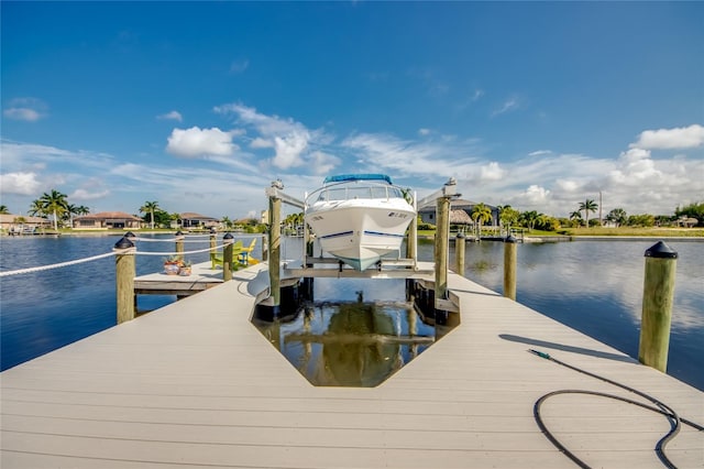 3715 NW 9th Ter, Cape Coral, FL 33993 - dock featuring boat lift and a water view