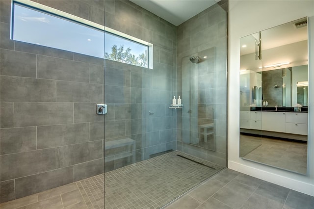 3715 NW 9th Ter, Cape Coral, FL 33993 - bathroom with tiled shower, tile patterned floors, and vanity