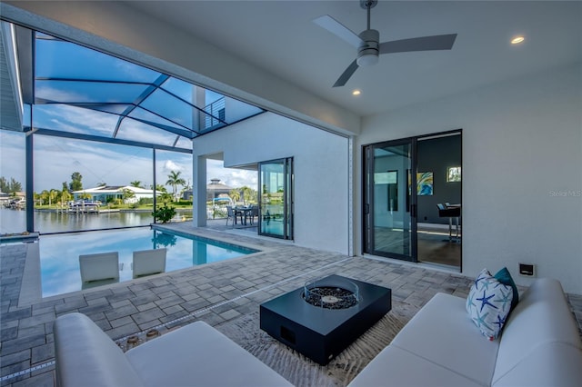 3715 NW 9th Ter, Cape Coral, FL 33993 - outdoor pool with a patio, an outdoor living space, a water view, ceiling fan, and a lanai