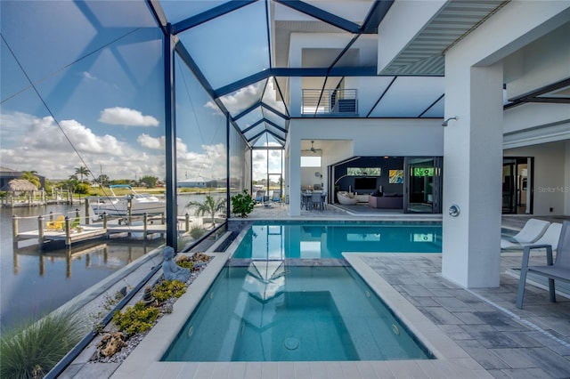 3715 NW 9th Ter, Cape Coral, FL 33993 - view of swimming pool featuring a patio, an outdoor living space, a pool with connected hot tub, a water view, and glass enclosure