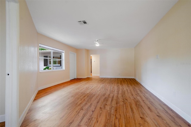 empty room with light hardwood / wood-style floors