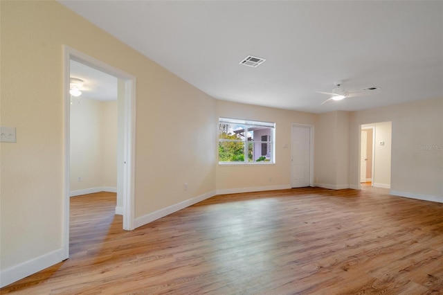 spare room with light hardwood / wood-style flooring and ceiling fan