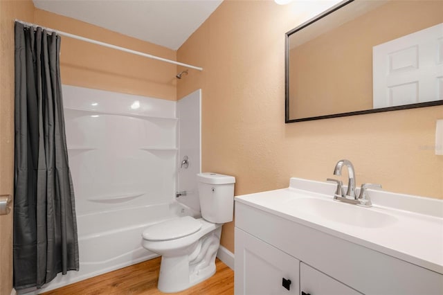 full bathroom featuring shower / bath combo with shower curtain, toilet, wood-type flooring, and vanity