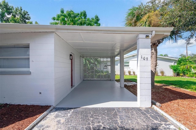 view of parking / parking lot featuring a carport