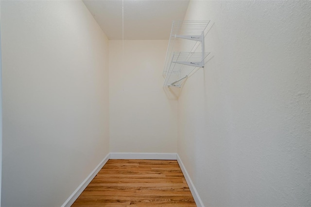 spacious closet featuring light hardwood / wood-style floors