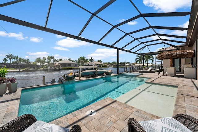 view of swimming pool featuring a water view, a patio area, and glass enclosure