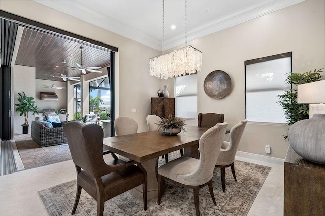 dining area featuring ceiling fan with notable chandelier and ornamental molding