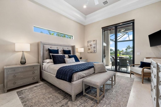 bedroom featuring a high ceiling, a tray ceiling, access to outside, and ornamental molding