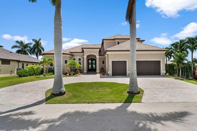 view of front facade featuring a front lawn and a garage