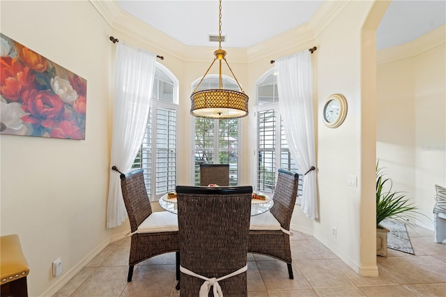 tiled dining room with ornamental molding