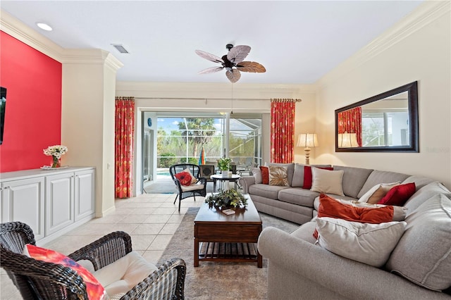 tiled living room with ceiling fan and crown molding