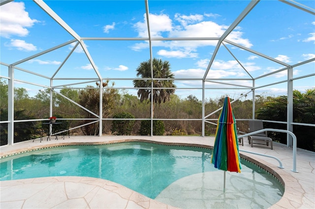 view of pool featuring a lanai and a patio area