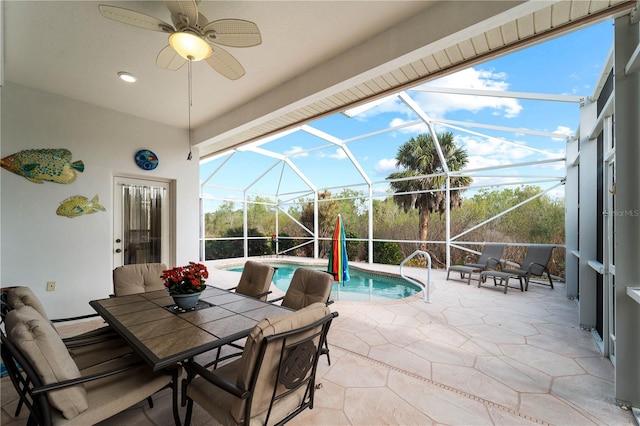 view of patio / terrace featuring glass enclosure and ceiling fan