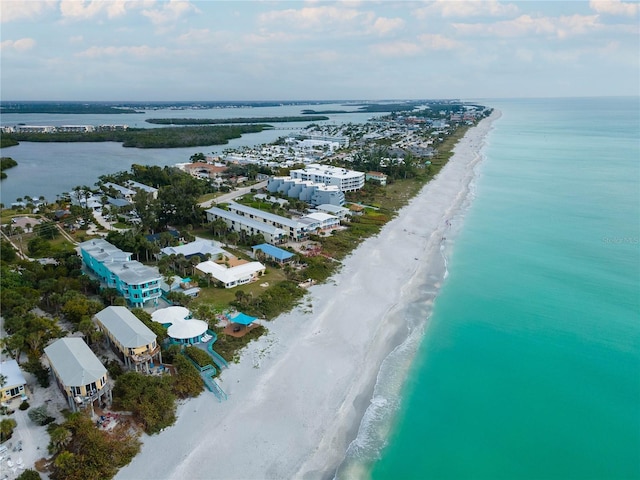 birds eye view of property featuring a view of the beach and a water view