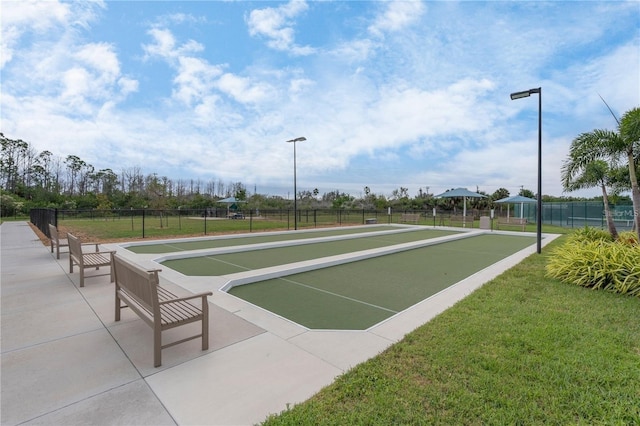 view of property's community featuring a yard