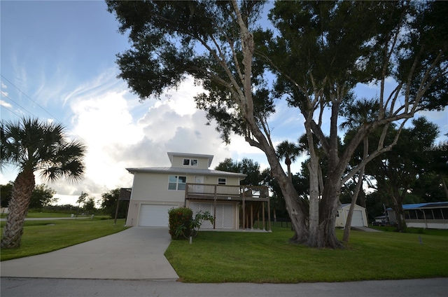 view of front facade with a front yard and a garage