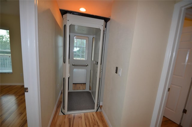 corridor featuring light wood-type flooring