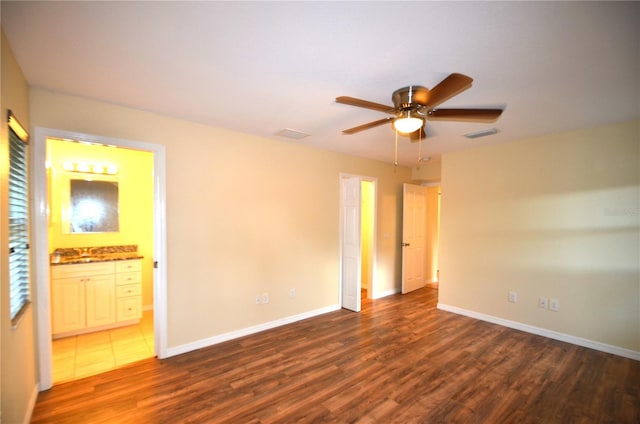 interior space featuring ceiling fan and dark hardwood / wood-style floors