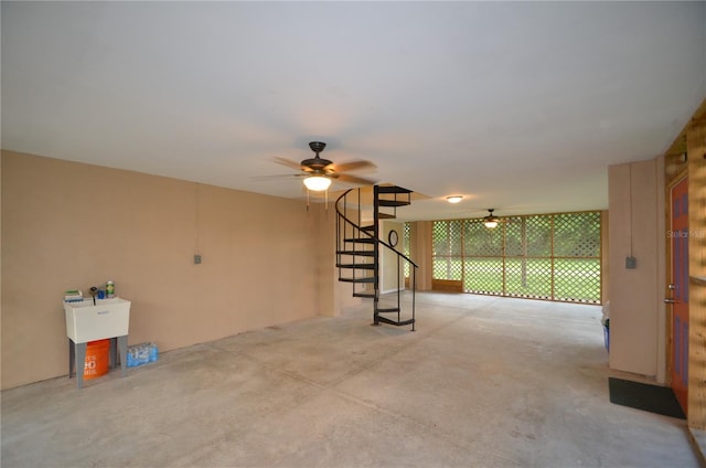 empty room featuring ceiling fan and sink