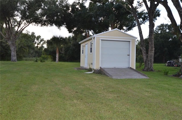 garage featuring a lawn