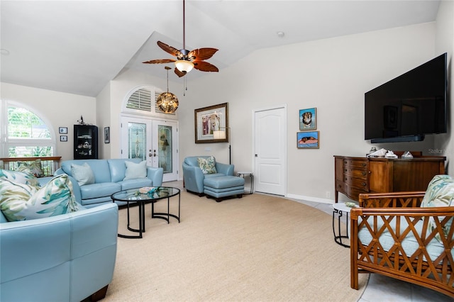 living room with ceiling fan and lofted ceiling