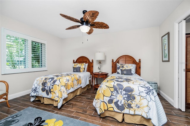 bedroom featuring ceiling fan and dark hardwood / wood-style flooring