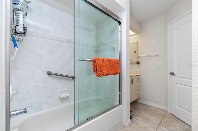 bathroom featuring tile patterned floors, vanity, and bath / shower combo with glass door