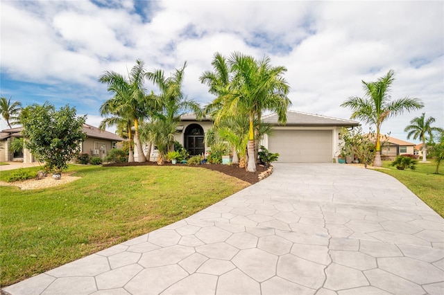 view of front facade featuring a garage and a front yard