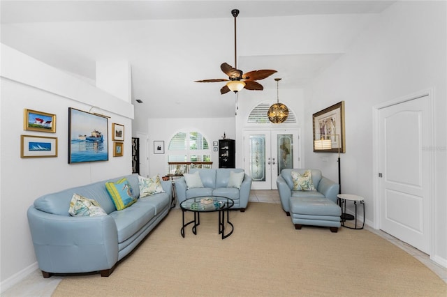 living room featuring ceiling fan, french doors, and high vaulted ceiling