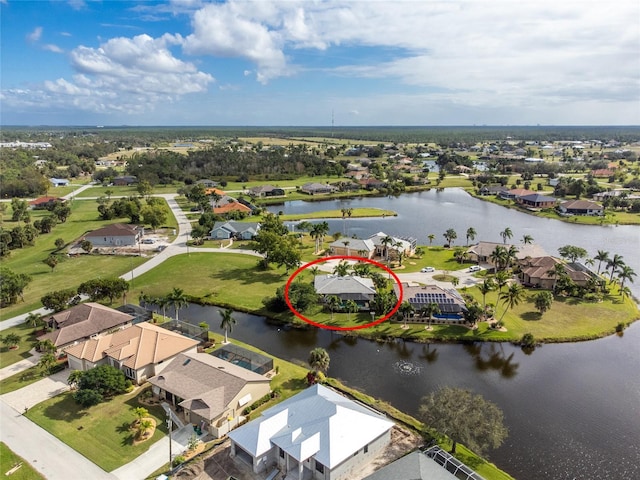 bird's eye view with a water view and a residential view