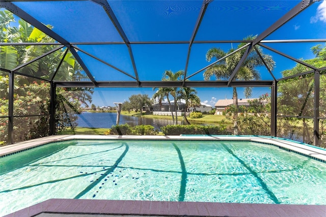 outdoor pool featuring a water view and glass enclosure