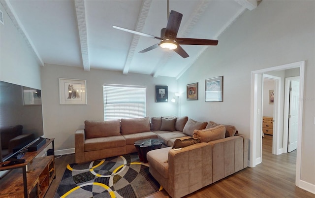 living room featuring lofted ceiling with beams, hardwood / wood-style floors, and ceiling fan