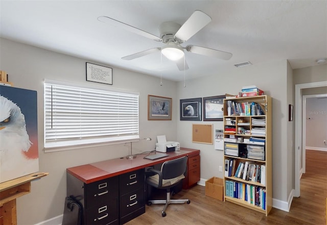 office area with hardwood / wood-style floors and ceiling fan