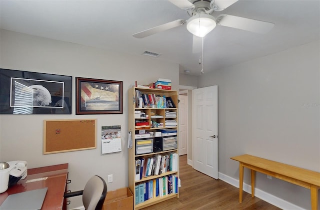 home office featuring ceiling fan and hardwood / wood-style floors