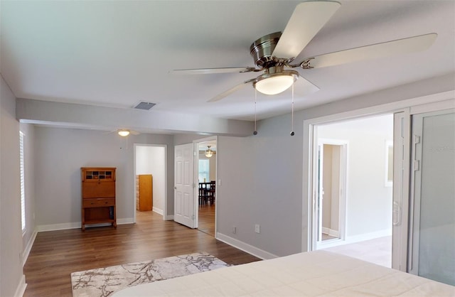 bedroom with hardwood / wood-style floors and ceiling fan