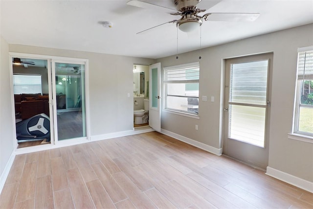 unfurnished room featuring ceiling fan and light hardwood / wood-style floors